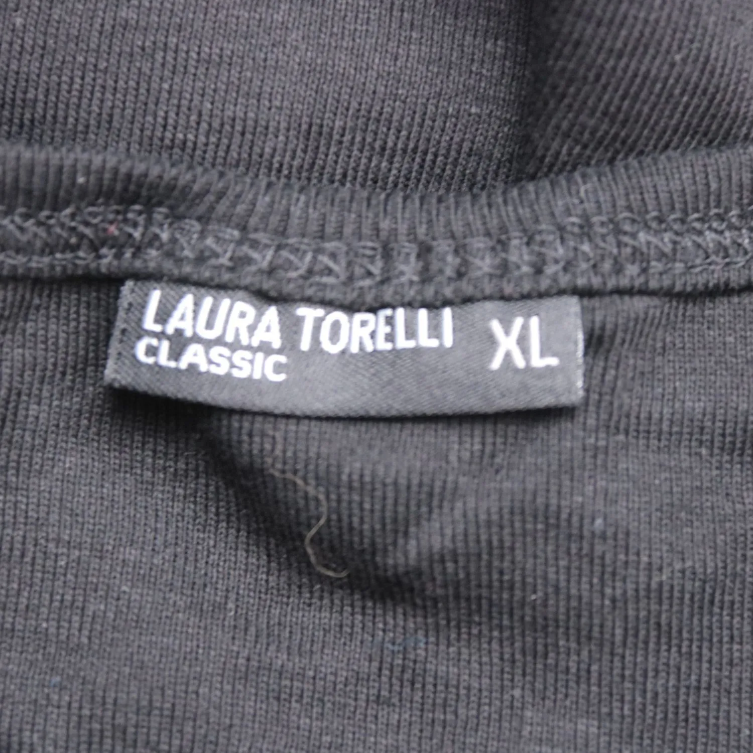 топ Laura Torelli